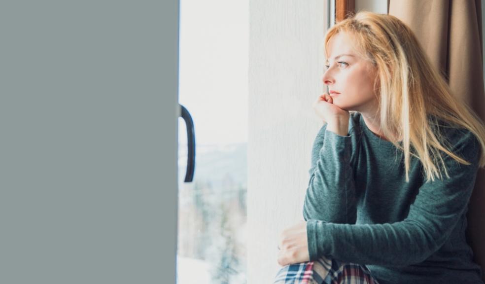 picture of a woman looking out of a window