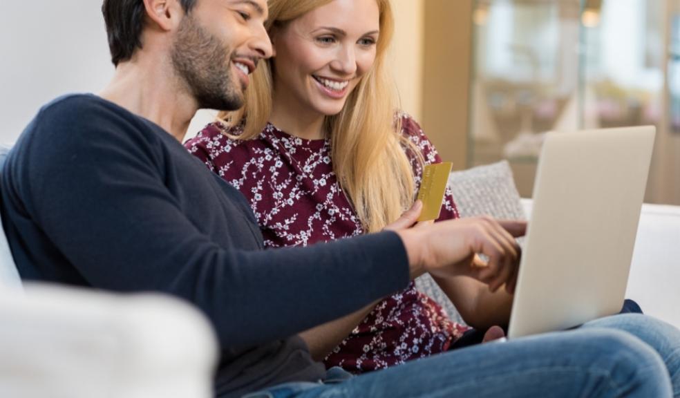 picture of a happy couple paying bills online