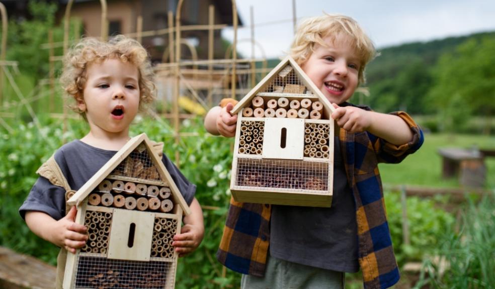 picture of children making a bug hotel