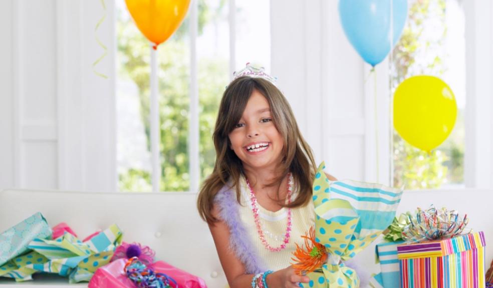 picture of a child with birthday presents