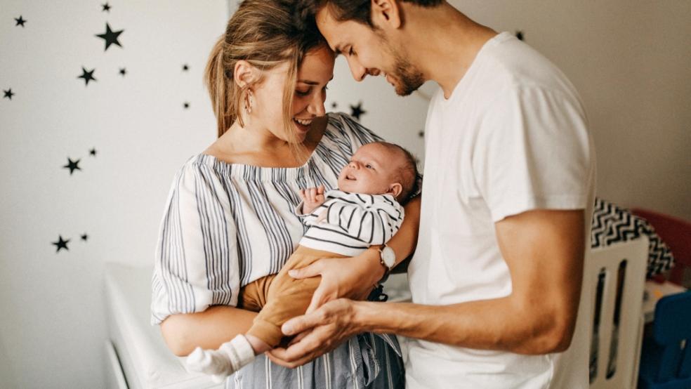 picture of parents holding a baby