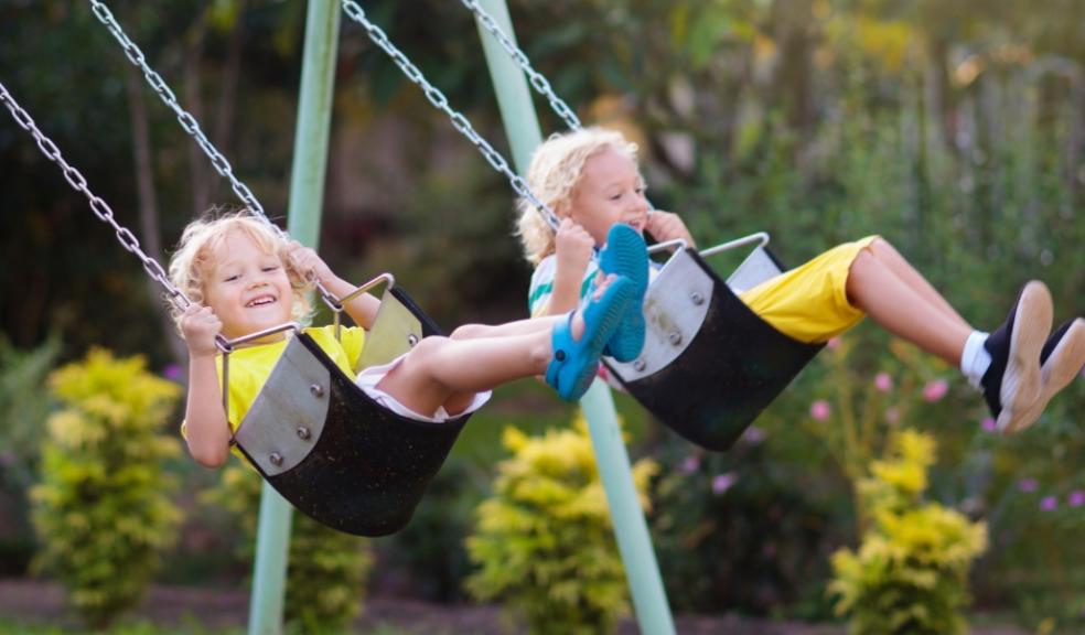 picture of children playing on swings