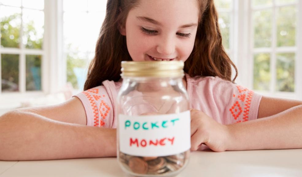 picture of a a child with a pocket money jar