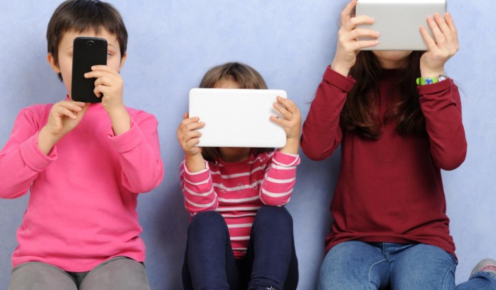 picture of children on devices