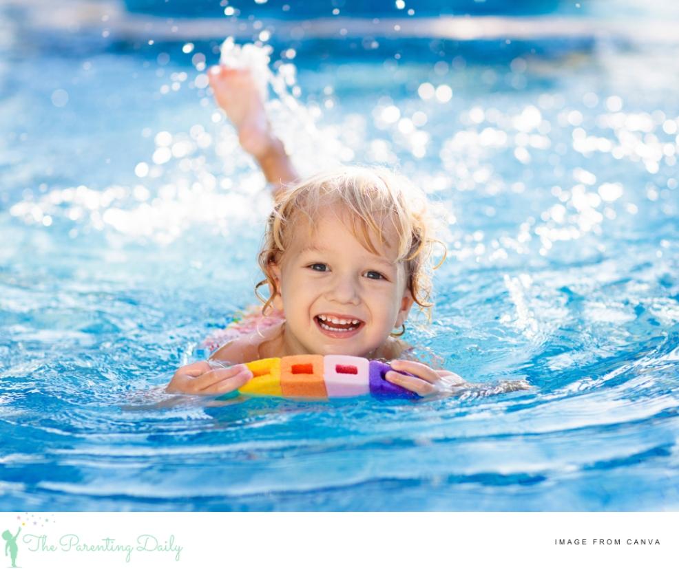 picture of a happy child in a swimming pool