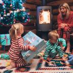 picture of children opening Cosatto toys at Christmas 