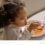 picture of a child eating in a cafe