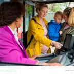 picture of a family getting on a bus to go on a day out