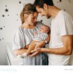 A family with young baby enjoying happy life with secure health cash plans