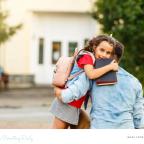 picture of a child being taken to school by parent