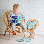 picture of a child reading Ditty Bird books