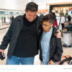 picture of a father and son at an airport