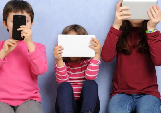 picture of children on devices
