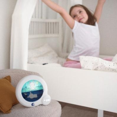 picture of a child waking up next to a Kids Essential Clock