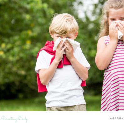 picture of children with allergies blowing their noses