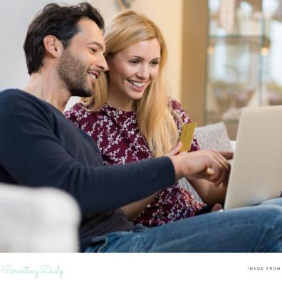 picture of a happy couple paying bills online