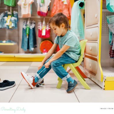 picture of a a child trying on shoes in a shop