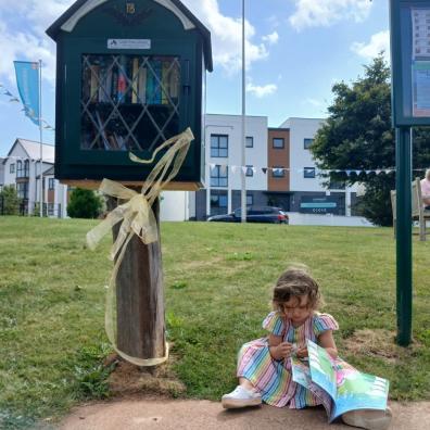 picture of a child using Tithebarns Little Free Library