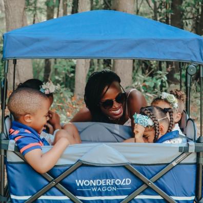 picture of a family using blue wonderfold wagon