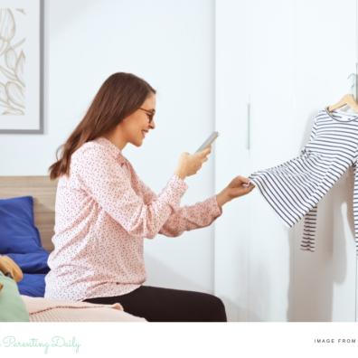 picture of a woman taking pictures of clothes to sell online