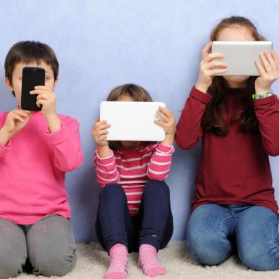 picture of children on devices